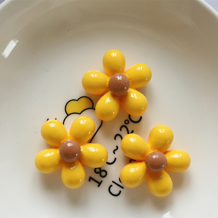 Fleur jaune pailletée