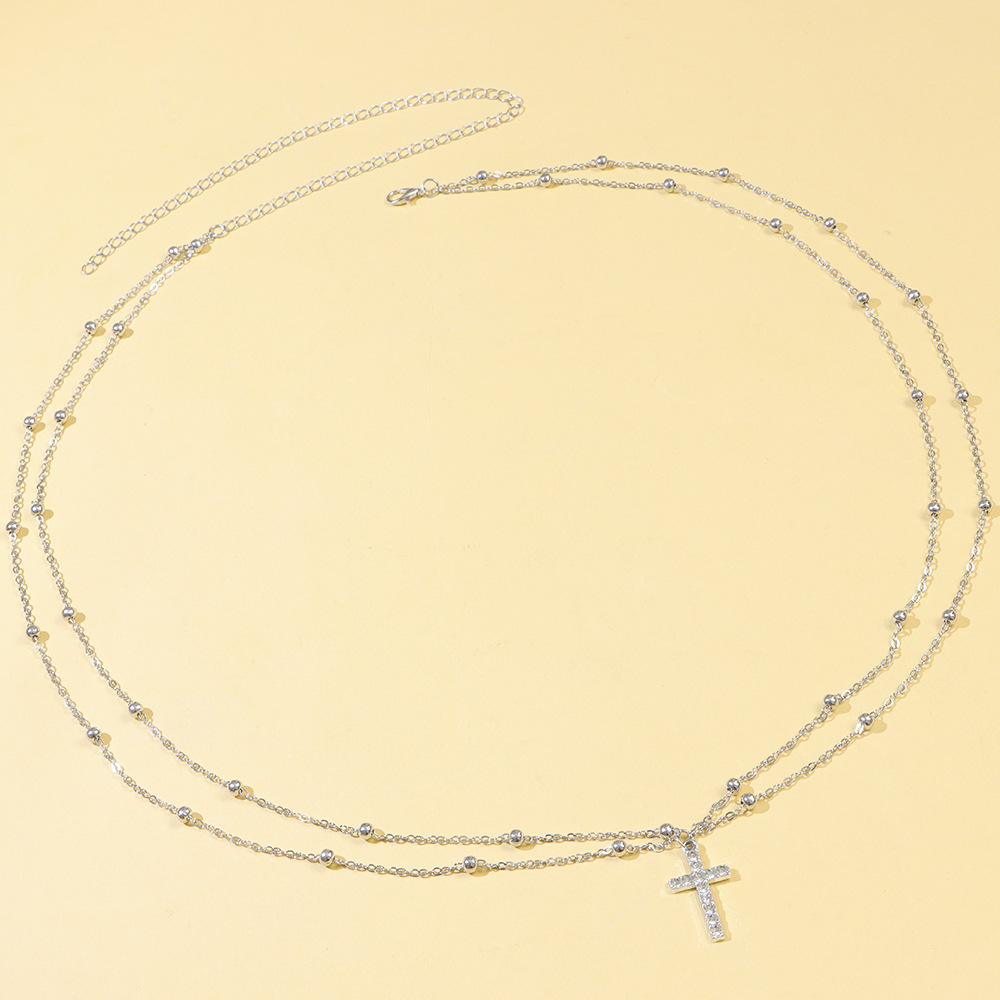 Cadena de cintura de doble capa con cruz plateada