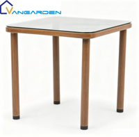 Ensemble table et chaises de salle à manger Teslin pour événements extérieurs modernes, confortable, décontracté, durable, avec panneau en verre de haute qualité, idéal pour villa, hôtel, cour.