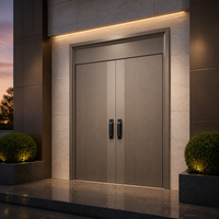 Porte principale contemporaine en acier champagne à double battant avec poignées à empreinte digitale pour showroom design