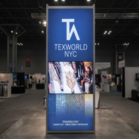 Stand d'exposition personnalisé 20x20 avec écran rétroéclairé SEG et support TV pour Texworld New York City Été 2027