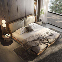 Lit king size minimaliste italien avec tête de lit capitonnée surdimensionnée, lit flottant luxueux rembourré pour chambre principale