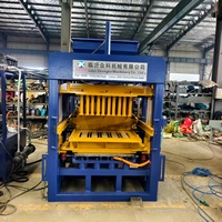 Machine de production automatique de briques en ciment QT4-15B avec système de changement de moule