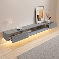 Meuble TV mural flottant gris en bois au design moderne avec cheminée électrique intégrée pour salon
