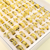Ensemble de 100 pièces. Vente directe d'usine de bagues en acier inoxydable 18k. Tendance et polyvalent, taille ajustable
