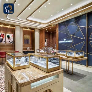 การออกแบบตกแต่งภายในร้านขายนาฬิกาและเครื่องประดับสุดหรู <span class=keywords><strong>ตู้</strong></span>โชว์กระจกโค้ง กรอบโลหะสีทอง พร้อมเคาน์เตอร์กลางรูปทรงเกาะ - Product Image 3