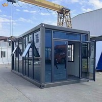 Maison conteneur à mur-rideau en verre haut de gamme, prête à l'installation, construction modulaire en acier pour espace commercial extérieur