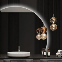 Miroir de salle de bain rond moderne à LED avec écran tactile intelligent demi-lune irrégulier rétro-éclairé avec fonction lumineuse pour la maison ou l'hôtel
