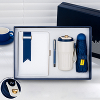 Ensemble cadeau de luxe personnalisé pour entreprise, comprenant un carnet, une tasse à café, un parapluie promotionnel et un logo personnalisé