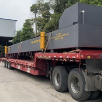 Système de chargement automatique de conteneurs pour machines lourdes et équipements industriels de grande taille, machine de manutention de conteneurs
