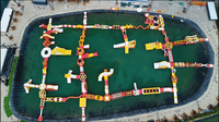 Parc aquatique gonflable flottant Fun Wolong avec parcours d'obstacles et trampoline pour la mer et le lac
