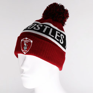 Gorro de Invierno con Emblema de Equipo Deportivo, Diseño Jacquard con Texto y Pompones, para Artículos de Fanáticos y Uso en Días de Partido - Product Image 1