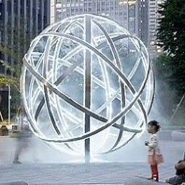 Sculpture en boule creuse en acier inoxydable grand paysage d'extérieur personnalisé statue luminescente en métal à vendre