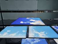 2025 Illusion infinie sans couture pour les intérieurs modernes Panneau de lumière bleu ciel sans cadre à effet de nuage monté au plafond ultra-mince