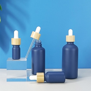 Custom Navy Blue Cosmetic Essential Oil Bottle10ml 20ml 30ml 50ml 100ml Glass Serum Dropper <b>Bottle</b> With Bamboo Cap Ring - Product Image 1