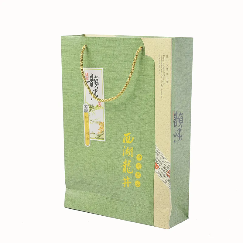 Il regalo di lusso con Logo personalizzato trasporta la borsa della spesa in carta di cartone con manico a nastro