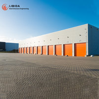 Entrepôt à structure en acier certifié CE, à plusieurs étages, préfabriqué pour la logistique et le stockage
