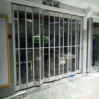 Porte pliante moderne en polycarbonate transparent avec cadre en alliage d'aluminium, porte accordéon manuelle transparente comme du cristal pour devanture de magasin de détail
