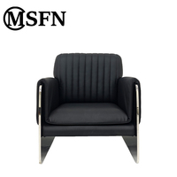 Fauteuil lounge en cuir véritable Bauhaus, dossier plissé noir, accoudoirs en acier inoxydable poli, fauteuil moderne pour salon, lecture