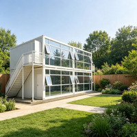Villa préfabriquée de luxe sur mesure à deux étages, maison modulaire moderne avec mur-rideau en verre et escalier