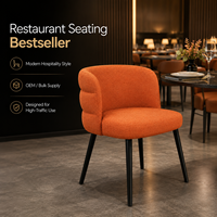 Fauteuil Boucle en corail, dossier enroulé avec assise rembourrée fine sur pieds coniques Raven, idéal pour salle à manger décontractée et salle de thé de l'après-midi