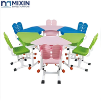 Ensemble de bureau et chaise scolaire moderne, trapézoïdal, modulaire, écologique, réglable en hauteur avec mécanisme à bouton manuel pour l'étude des élèves