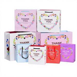 Bolsa de Regalo de Cartón Blanco Exquisita al por Mayor de Fábrica con Asa de Cuerda, Impresión Offset Personalizable, Embalaje para Dulces y Frutas, Guangdong - Product Image 1