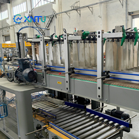 Machine de chargement automatique de cartons électrique haute efficacité XINTU avec contrôle PLC, économie d'énergie, prix compétitif pour la fin de ligne