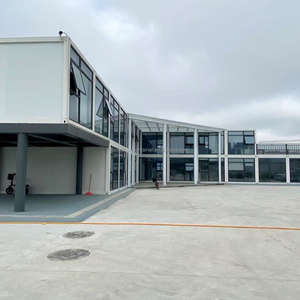 Bâtiment <span class=keywords><strong>de</strong></span> <span class=keywords><strong>bureau</strong></span> modulaire préfabriqué Postes <span class=keywords><strong>de</strong></span> travail modulaires pour bureaux Maison préfabriquée moderne en conteneur avec revêtement extérieur et mur en verre - Product Image 2