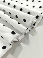 Robe mini dos nu à pois blancs et noirs pour femme, col en V profond, taille nouée, ourlet à volants, idéale pour les fêtes estivales, vente en gros, personnalisable