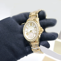 Montre de luxe pour femme MKOriginals en nacre, avec lunette en cristal festonné, sous-cadran, boîtier serti de diamants, étanche, chronographe doré