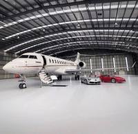 Hangar de acero prefabricado de diseño moderno de gran envergadura, montaje fácil con puerta más grande, edificio de estructura de acero