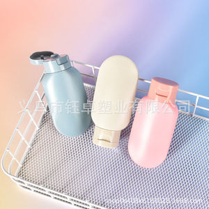 ขวดเก็บของแบบพกพาทรงกลมพร้อมฝาปิดแบบพลิกสำหรับแชมพูและเครื่องสำอาง - Product Image 1