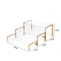 Rehausseur de chaussures en acrylique transparent moderne et écologique avec bord doré Présentoir de vitrine de haute qualité pour talons hauts