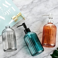 Vorrätige Bunte 400ml Flüssigseifenspender-Flasche Luxuriöse Glas-Shampooflasche mit Goldpumpe Siebdruck Gesichtsreiniger