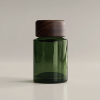 Bouteilles diffuseuses rondes en verre vert personnalisées en usine avec couvercles en bois 50-300ml Contenants en verre d'aromathérapie avec logo personnalisé