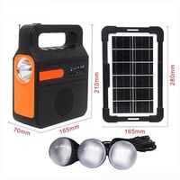 Nouvelle Banque d'alimentation solaire multifonctionnelle avec radio FM et port de charge USB, ainsi que un ensemble d'ampoules