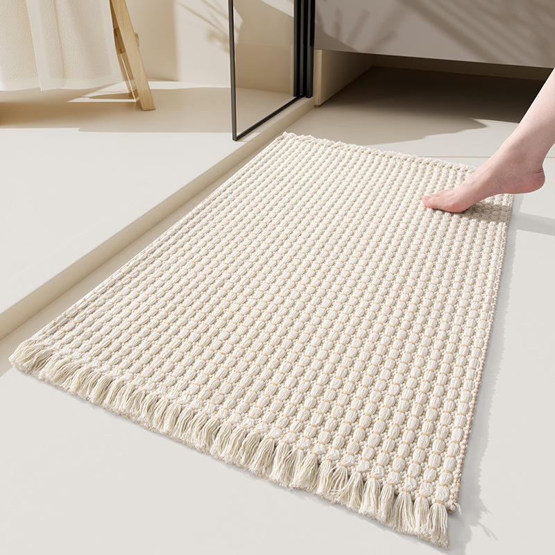 Alfombra de baño tejida con borlas - beige