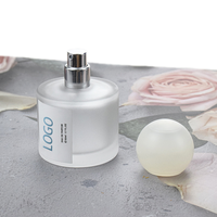 Flacons de parfum cylindriques en verre vides de luxe personnalisables avec pulvérisateur à pompe, 30ml/50ml/100ml, impression sérigraphiée, en stock