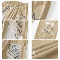 Pantalon Streetwear pour Homme Imprimé Graffiti Numérique Effet Peinture Éclaboussée Coupe Large à Panneaux Décontracté Confortable Style Tendance