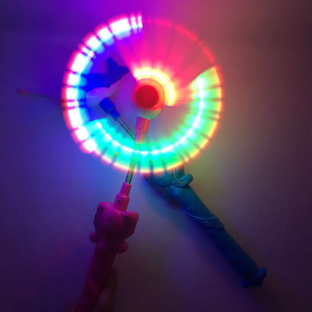 Música eléctrica para niños pez luminoso Flash Stick molino de viento giratorio palo mágico brillo LED lámpara de luz colorida juguete