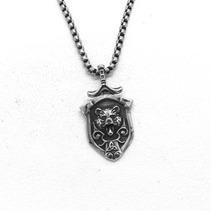 Yunnique – collier avec pendentif bouclier de loup unisexe en acier inoxydable, bijoux de style minimaliste pour hommes et femmes, accessoire de mode - Product Image 1