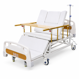 Lit médicalisé manuel à rotation latérale avec tête de lit en ABS, barrières latérales pliables, trou pour commode et poteau porte-perfusion - Product Image 1