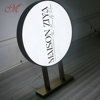 Boîte d'éclairage à LED en acrylique double face personnalisée cadre circulaire en métal pour la publicité commerciale extérieure populaire dans les magasins