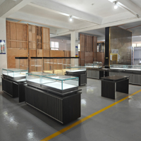 Comptoir de présentation de bijoux moderne, vitrine en verre avec éclairage LED, table de présentation sur mesure en acier inoxydable pour bijouterie
