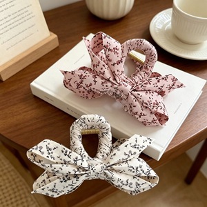 Korean style small floral fabric wrap-around crisscross hair <b>clip</b>, a popular and simple hair accessory for updos. - Product Image 1