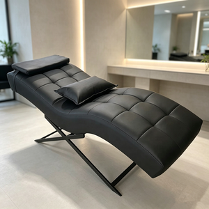Meilleures ventes : Lit de massage incurvé moderne pour salon de beauté, en cuir noir, réglable et pliable, avec base en métal doré de luxe, idéal pour les extensions de cils - Product Image 1