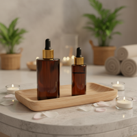 Flacon rond en verre ambré de 30 ml et 100 ml avec bouchon compte-gouttes doré et bulbe en TPE noir pour huile pour le visage et huile pour les cheveux