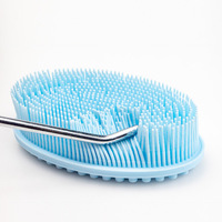 Offre Spéciale logo personnalisé Brosse de bain en silicone de qualité supérieure Brosse exfoliante pour le dos, le visage et le cuir chevelu Brosse en silicone noir pour le corps