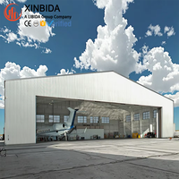 Hangar d'avion préfabriqué modulaire en acier, atelier de stationnement d'hélicoptères, grande porte latérale, capacité de charge stable